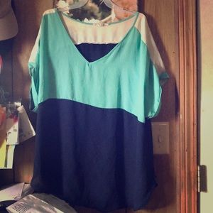 A greenish, blue and white patterned blouse.